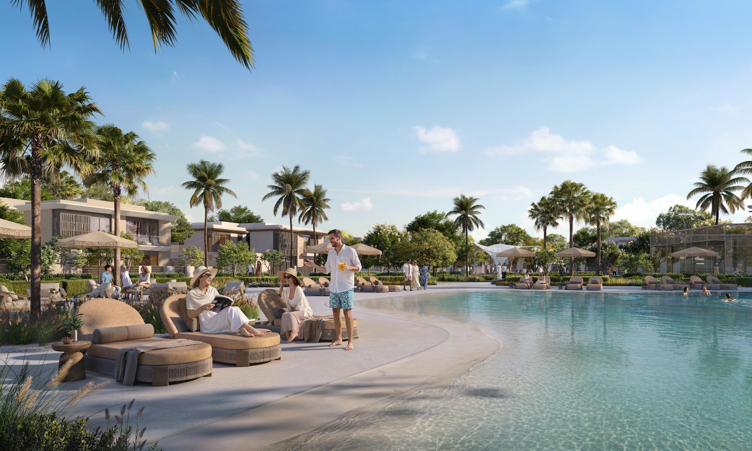 Community pool with a shallow kids’ area and loungers under palms at Talay