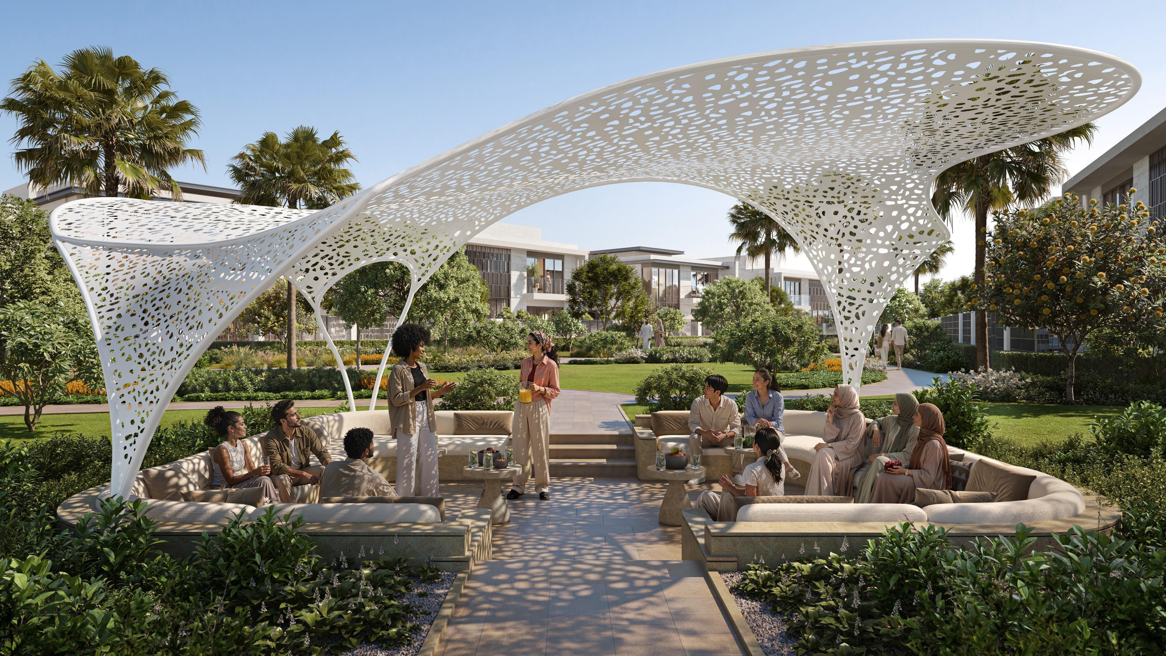 The outdoor majlis pavilion at Talay: a perforated, curving canopy over a sunken seating area in the gardens
