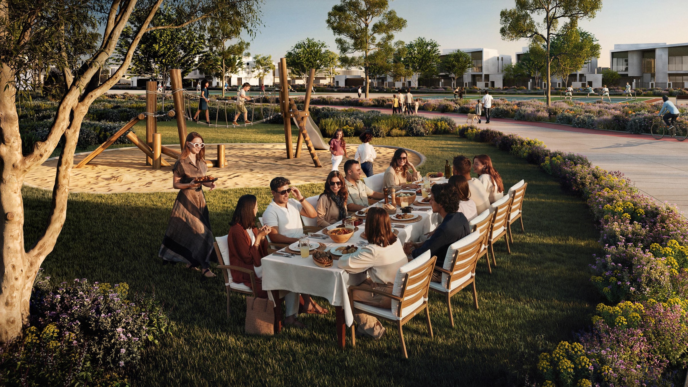 Eine lange Tafel für ein Zusammenkommen in einem Nachbarschaftspark in Marsa Al Saadiyat