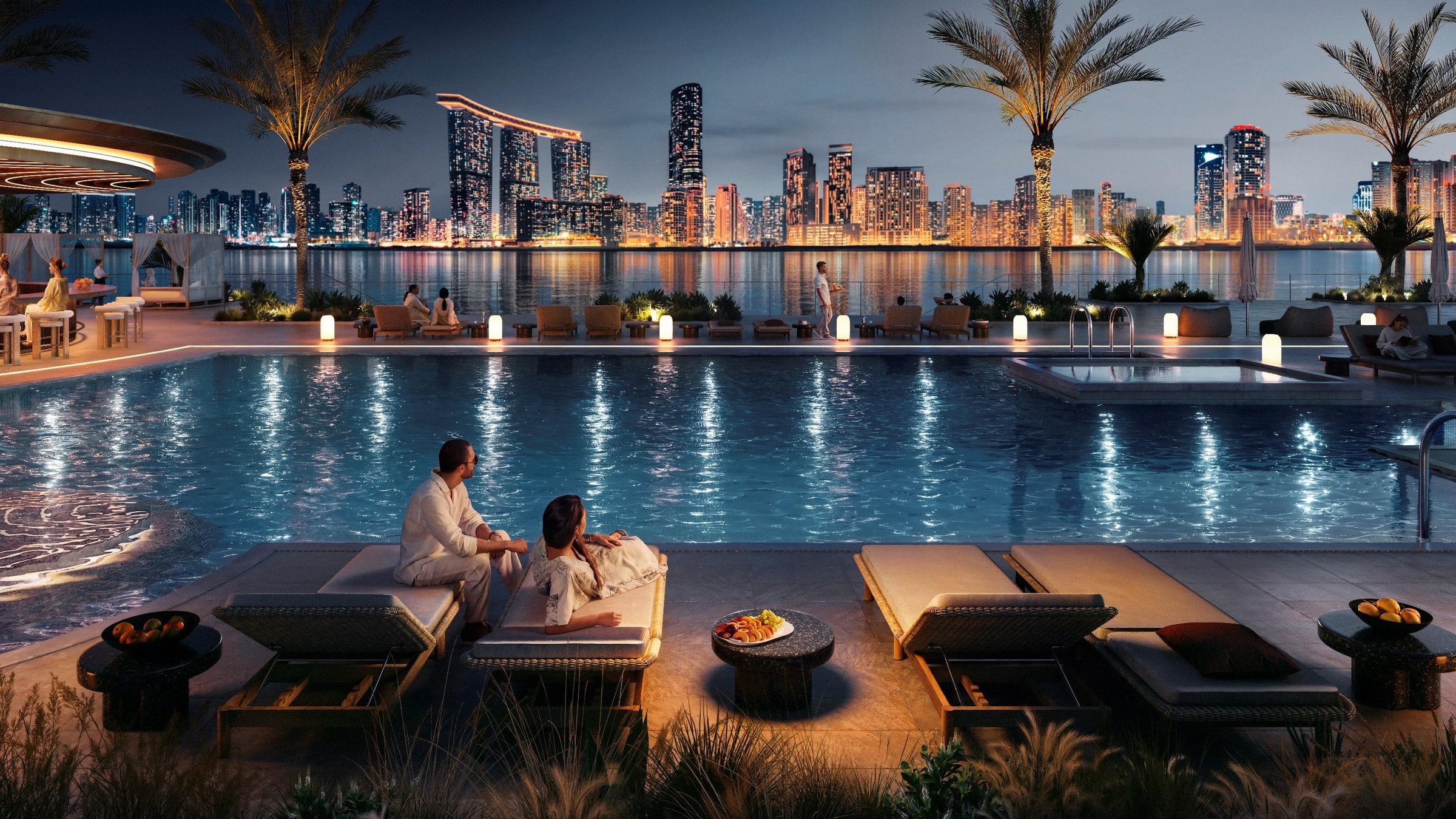 Der Pool des Waterfront Wellness Club bei Nacht mit Blick auf die Skyline von Abu Dhabi