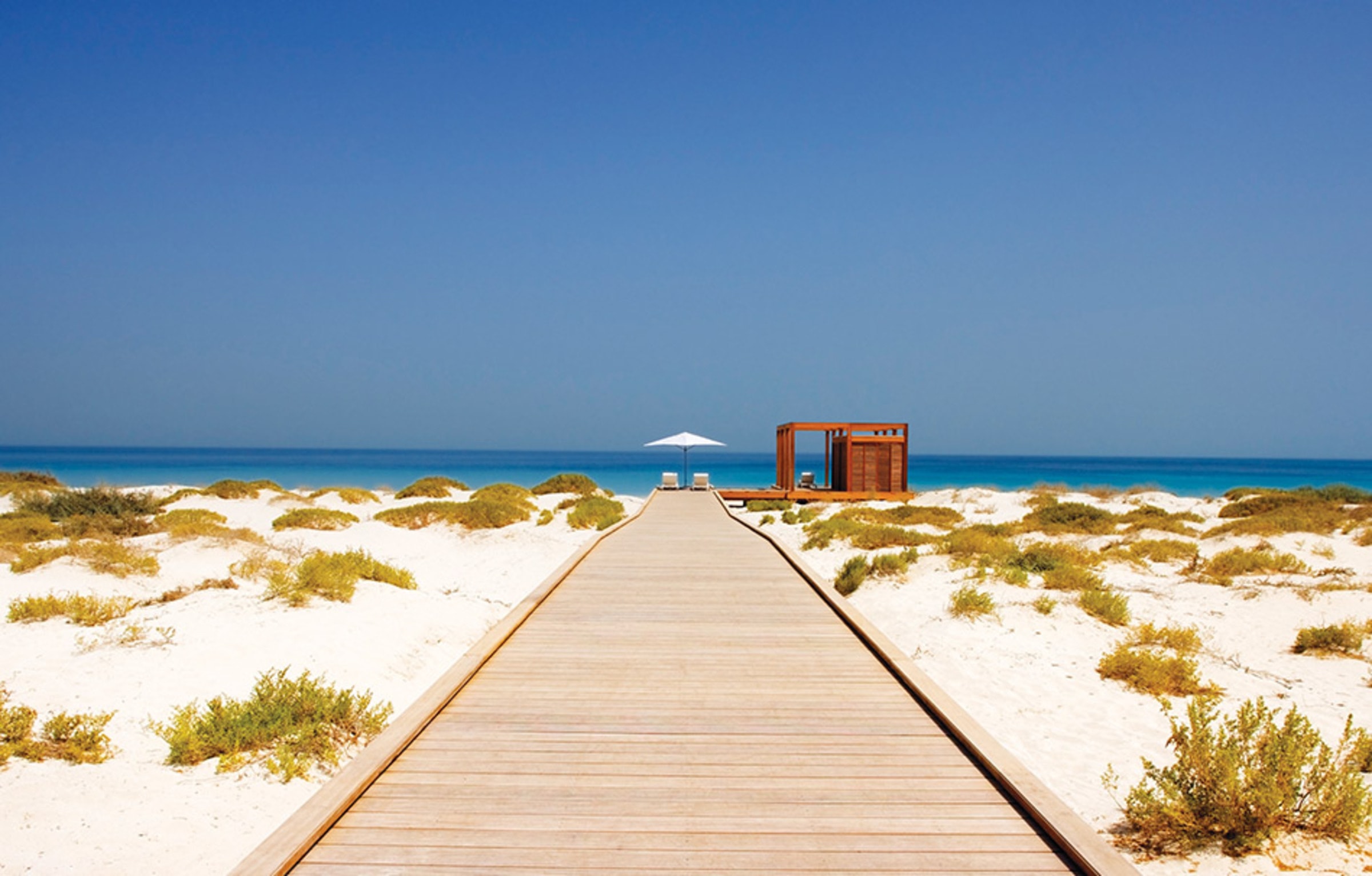Surroundings: the boardwalk through the dunes to the beach on Saadiyat Island