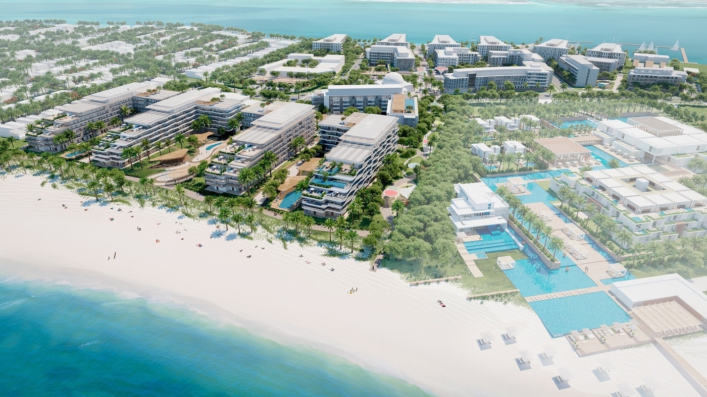 Aerial render of Qaryat Al Hidd, showing its low-rise apartment buildings directly on the beach